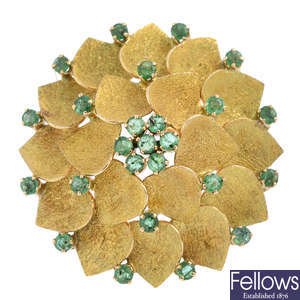 A mid 20th century 14ct gold emerald floral brooch.