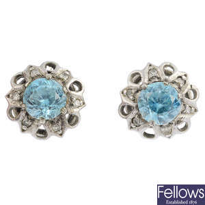 A pair of zircon and diamond earrings.