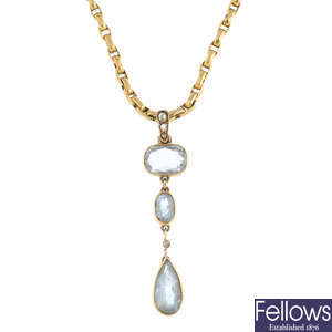 An early 20th century gold aquamarine and diamond pendant, on near-period gold chain.