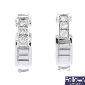 TIFFANY & CO. - a pair of diamond 'Atlas' earrings.