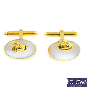 A pair of 18ct gold mother-of-pearl and diamond Curling Stone cufflinks.