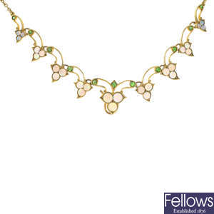 An early 20th century 15ct gold opal and demantoid garnet necklace.