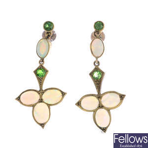 A pair of early 20th century 9ct gold opal and demantoid garnet foliate earrings.