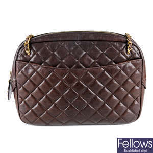 CHANEL - a large brown calf leather quilted camera handbag.