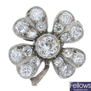 An early 20th century platinum diamond four-leaf clover ring, with later band.