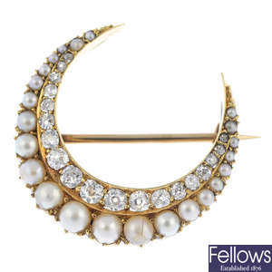 An early 20th century gold split pearl and diamond crescent brooch.