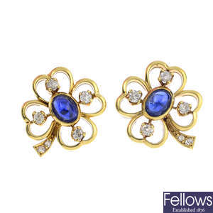 A pair of sapphire and diamond four-leaf clover earrings.