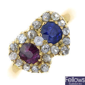 An early 20th century gold, ruby, sapphire and diamond hearts ring.