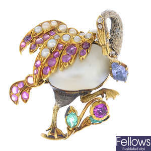 A saltwater natural blister pearl and gem-set bird pendant.