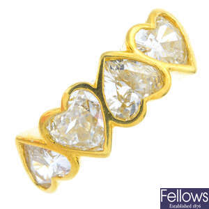 A heart-shape diamond four-stone ring.