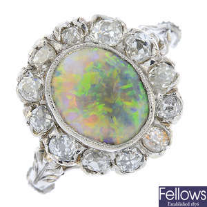 A gold and silver, opal and diamond cluster ring.