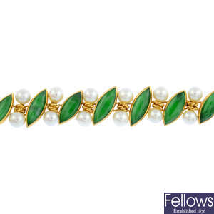 A gold jade and cultured pearl bracelet.