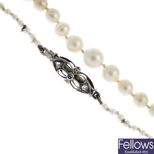 A natural pearl single-strand necklace, with diamond clasp.