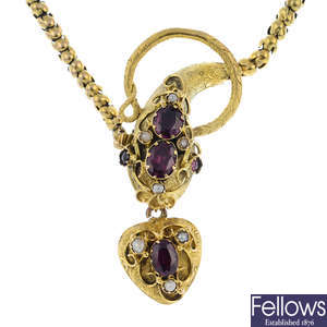 A late Victorian 18ct gold garnet and split pearl snake necklace.