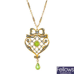 An early 20th century 9ct gold peridot and split pearl pendant, with 9ct gold chain.