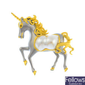 A cultured baroque pearl unicorn brooch.