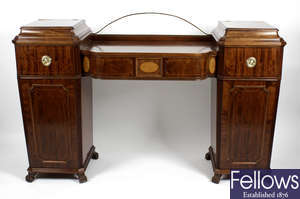 An early 20th century inlaid mahogany twin pedestal sideboard.