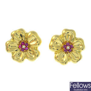 A pair of diamond and ruby floral earrings.