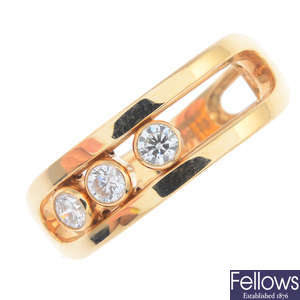 MESSIKA - an 18ct gold diamond three-stone ring.