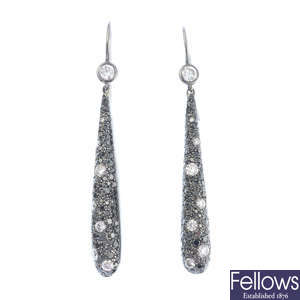 A pair of diamond and black gem earrings, by Kwiat.