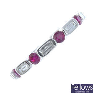 An 18ct white gold ruby and diamond full eternity ring.