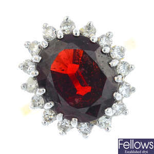 An 18ct gold garnet and diamond cluster ring.