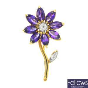 An 18ct gold amethyst and diamond flower brooch.