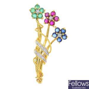 An 18ct gold emerald, sapphire and ruby floral brooch.