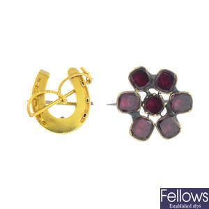 A mid 19th century garnet brooch, an early 20th century 15ct gold brooch and a coral bracelet.