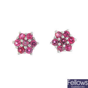 A pair of red sapphire floral cluster earrings.