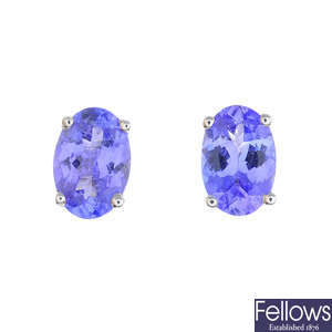 A pair of oval-shape tanzanite single-stone stud earrings.