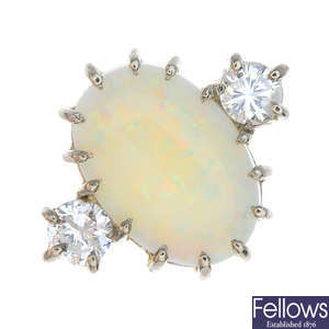 An 18ct gold opal and diamond three-stone ring.