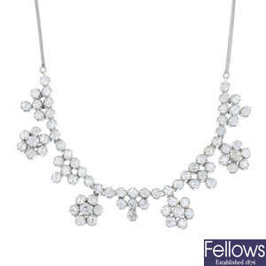 A diamond floral necklace.
