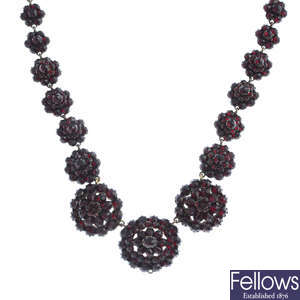 A late Victorian gold garnet necklace.
