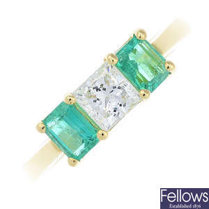 An 18ct gold diamond and emerald three-stone ring.