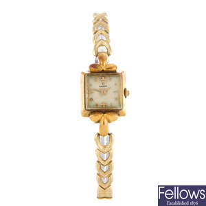 OMEGA - a lady's yellow metal bracelet watch with a lady's Omega bracelet watch.