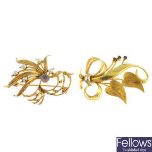 Three gold gem-set floral brooches.