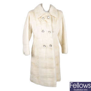 A knee-length pearl mink fitted coat.