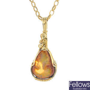 A boulder opal pendant, with 9ct gold chain.