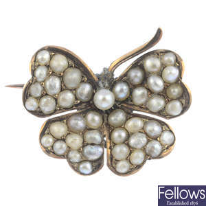 An early 20th century gold pearl and split pearl butterfly brooch.