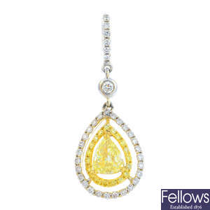 A diamond and yellow diamond pendant.