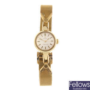 OMEGA - a lady's gold plated Ladymatic bracelet watch.