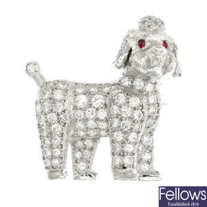 A diamond and ruby poodle dog brooch.