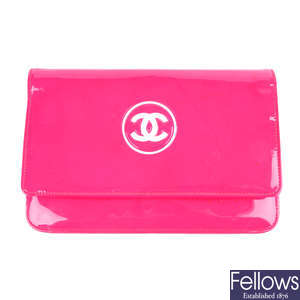 CHANEL - a pink patent leather WOC handbag.