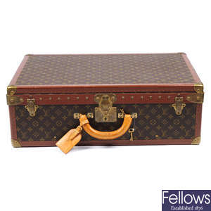 LOUIS VUITTON - a Monogram Alzer 65 hard suitcase.