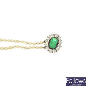 A pearl three-strand necklace, with emerald and diamond clasp.