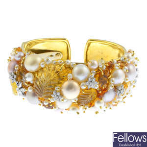 A diamond, cultured pearl and gem-set cuff bangle.