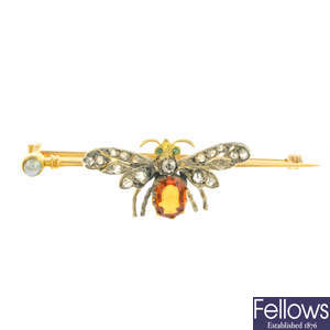 A late Victorian gold, diamond and garnet insect brooch.