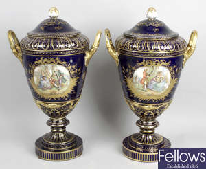 A pair of 20th century Sevres style porcelain vases and covers.
