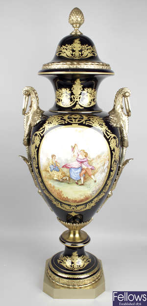 A large reproduction Sevres style porcelain twin handled vase.
